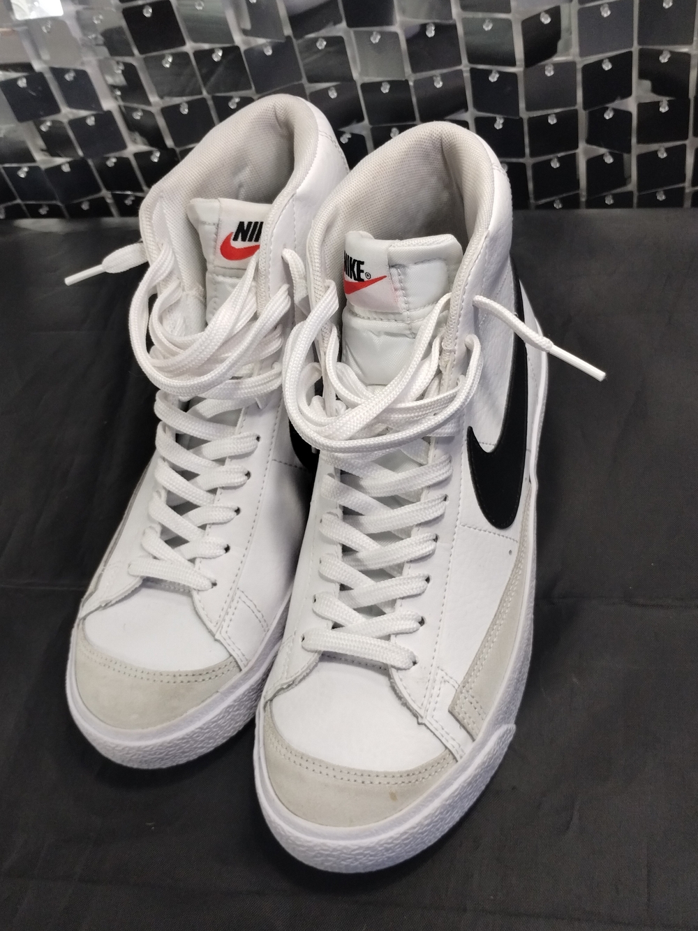 Nike Women’s White High-Top Sneakers with Black Swoosh